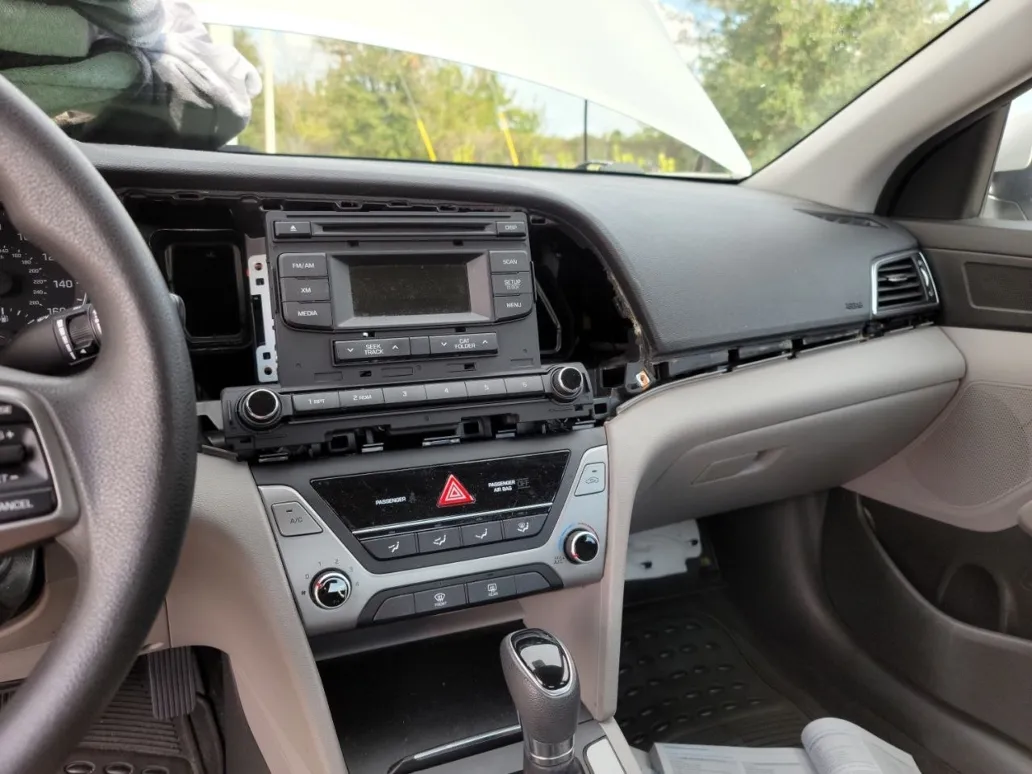 Car head unit replacement in progress